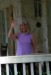 Debby Heitzke waves from her screen porch.